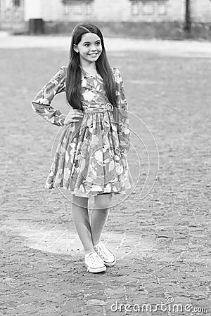 Fashion inspired by you. Fashion look of little girl. Happy child with long hair smile urban outdoors. Summer fashion Stock Photo
