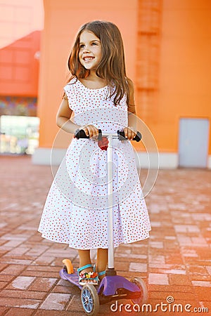 Fashion little joyful girl in dress Stock Photo