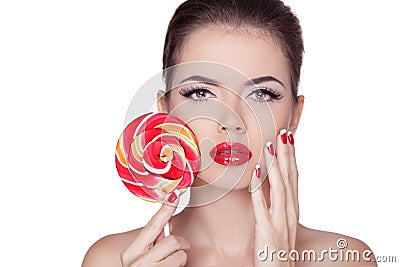 Fashion make up. Beauty Girl Portrait holding Colorful lollipop. Stock Photo