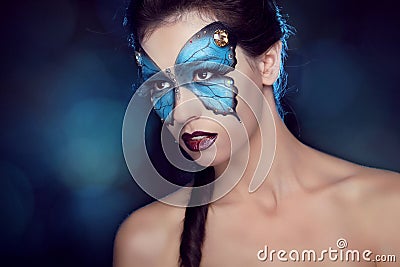 Fashion Make up. Butterfly makeup on face beautiful woman. Art P Stock Photo