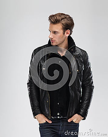 Fashion man, model leather jacket, gray background Stock Photo