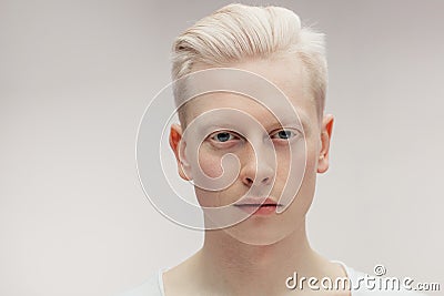 Fashion model male on white. Handsome albino guy closeup. Stock Photo