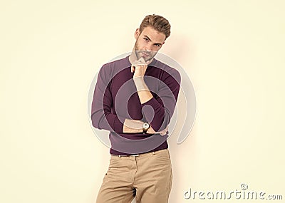 Fashion model pose in casual mens wear touching unshaven beard isolated on white, fashionist Stock Photo