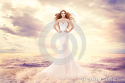 Fashion Model in Sea Waves, Beautiful Woman in Elegant White Dress Hairstyle Waving on Wind, Art Portrait Stock Photo