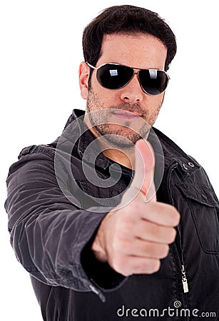 Fashion model showing thumbsup wearing sunglasses Stock Photo