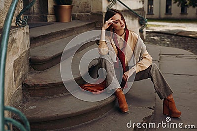 Fashion Model In Street. Beautiful Woman In Fashionable Clothes Stock Photo