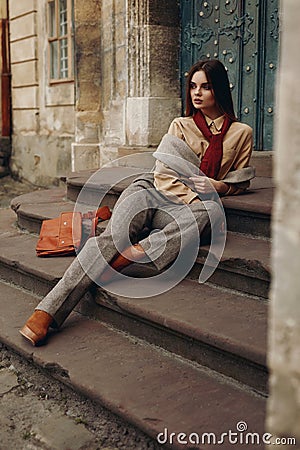 Fashion Model In Street. Beautiful Woman In Fashionable Clothes Stock Photo