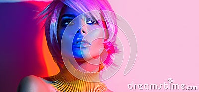 Fashion model woman in colorful bright lights Stock Photo