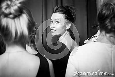 Fashion models prepared for runway by stylish designer. Black and white photography Stock Photo