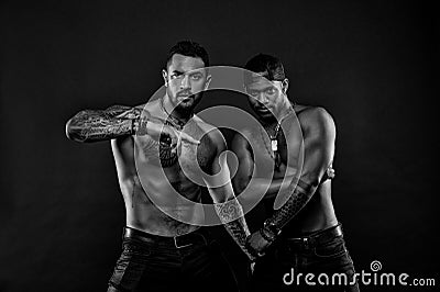 Fashion models with tattoo in jeans. Men with fit tattooed bodies. African and hispanic men with torsos. Sportsmen Stock Photo