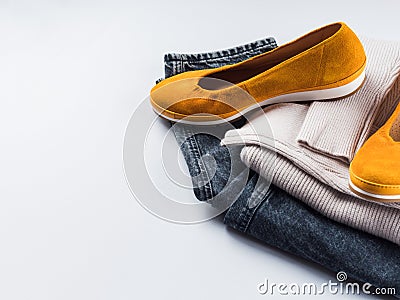 Fashion outfit jeans, yellow shoes, gray sweater Stock Photo