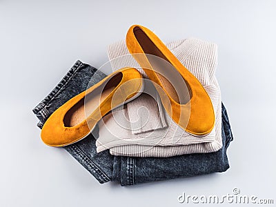 Fashion outfit jeans, yellow shoes, gray sweater Stock Photo