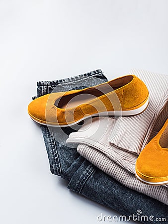 Fashion outfit jeans, yellow shoes, gray sweater Stock Photo