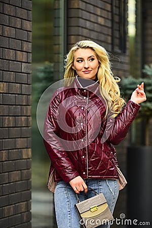 Fashion outfit. Little purse. Matching style and class with luxury and comfort. Feel authentic. Girl jacket urban style Stock Photo