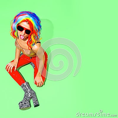 Fashion Party Lady in .multicolored wig and zebra boots. Club Disco style 90s. Minimal concept Stock Photo