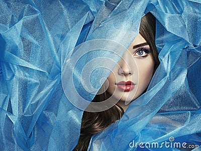 Fashion photo of beautiful women under blue veil Stock Photo