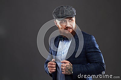 Fashion Portrait of bearded man in suit.old Hipster boy.handsome man in hat.Brutal Stock Photo