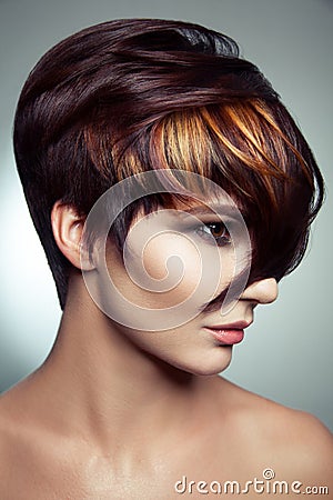 Fashion portrait of a beautiful girl with colored dyed hair, professional short hair coloring. Stock Photo