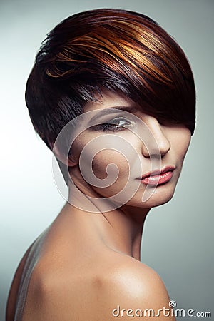 Fashion portrait of a beautiful girl with colored dyed hair, professional short hair coloring. Stock Photo