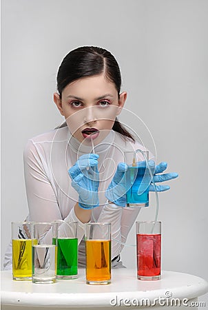 Fashion portrait of a girl who drinks unnatural fluids Stock Photo