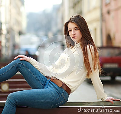 Fashion portrait stylish urban girl posing old city street Stock Photo