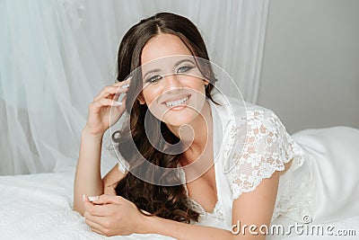 Fashion portrait of young elegant woman in bed. Morning Awakening woman on the bed Stock Photo