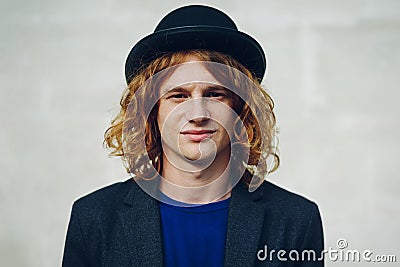 Fashion portrait of young reddish curly man Stock Photo