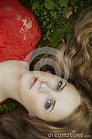 Fashion portrait of young sensual woman in garden Stock Photo