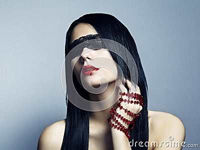 Fashion portrait of the young woman blindfold Stock Photo