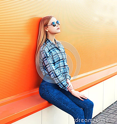 Fashion pretty blonde girl over colorful orange Stock Photo