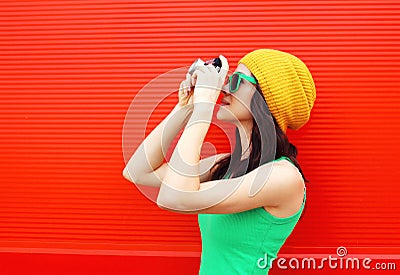 Fashion pretty cool girl wearing colorful clothes with camera Stock Photo