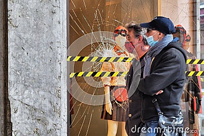 Fashion retail store glass window damaged during the riot protest against lockdown and related economic crisis Editorial Stock Photo