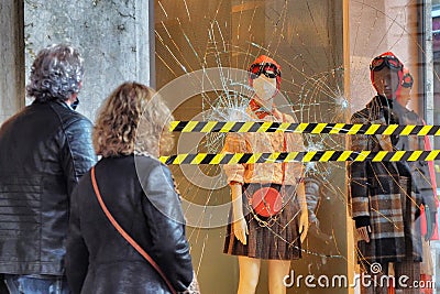 Fashion retail store glass window damaged during the riot protest against lockdown and related economic crisis Editorial Stock Photo