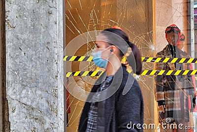 Fashion retail store glass window damaged during the riot protest against lockdown and related economic crisis Editorial Stock Photo