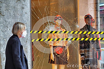 Fashion retail store glass window damaged during the riot protest against lockdown and related economic crisis Editorial Stock Photo