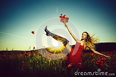 Fashion shooting in the field. summer girl in field of poppy seed Stock Photo