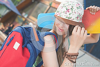 Fashion skateboarder young woman with a skateboard. Adventure, summer trip. Stock Photo