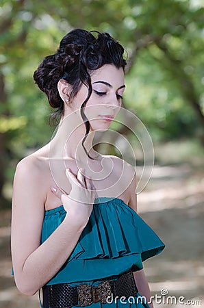 Fashion slim woman wearing green strapless dress Stock Photo