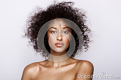 Fashion studio portrait of beautiful african american woman with perfect smooth glowing mulatto skin, make up Stock Photo