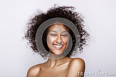 Fashion studio portrait of beautiful african american woman with perfect smooth glowing mulatto skin, make up Stock Photo