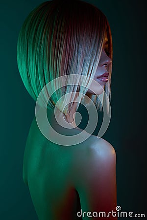 Asian woman in neon light. Beautiul blonde in night club Stock Photo