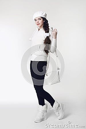 Fashion teen white style look. Fashionable young girl wears fur Stock Photo