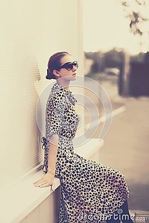 Fashion vintage style - beautiful elegant woman in leopard dress Stock Photo