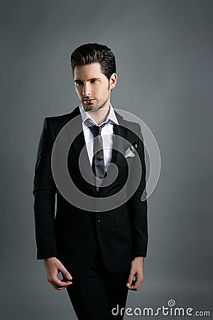 Fashion young businessman black suit casual tie Stock Photo