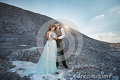 Fashionable and beautiful couple, happy blonde model girl with stylish hairstyle, in a white lace dress and stylish Stock Photo