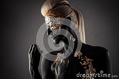 Fashionable black greasepaint and makeup of a beautiful woman Stock Photo