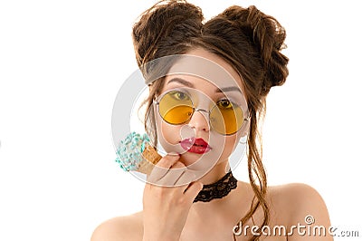 Fashionable brunette woman in round glasses with ice cream in hand Stock Photo