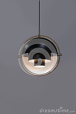 Fashionable chandelier with brass elements, black modern pendant lamp in loft style. Interesting hemispherical design Stock Photo