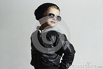 Fashionable child boy in sunglasses. winter style.Smiling Little boy Stock Photo