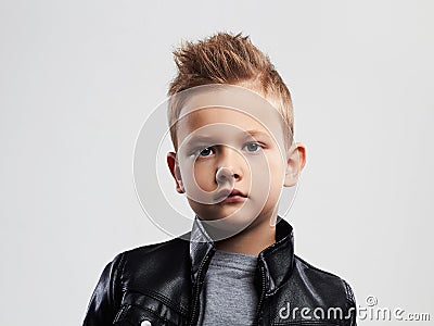 Fashionable child in leather coat.stylish child with trendy haircut Stock Photo